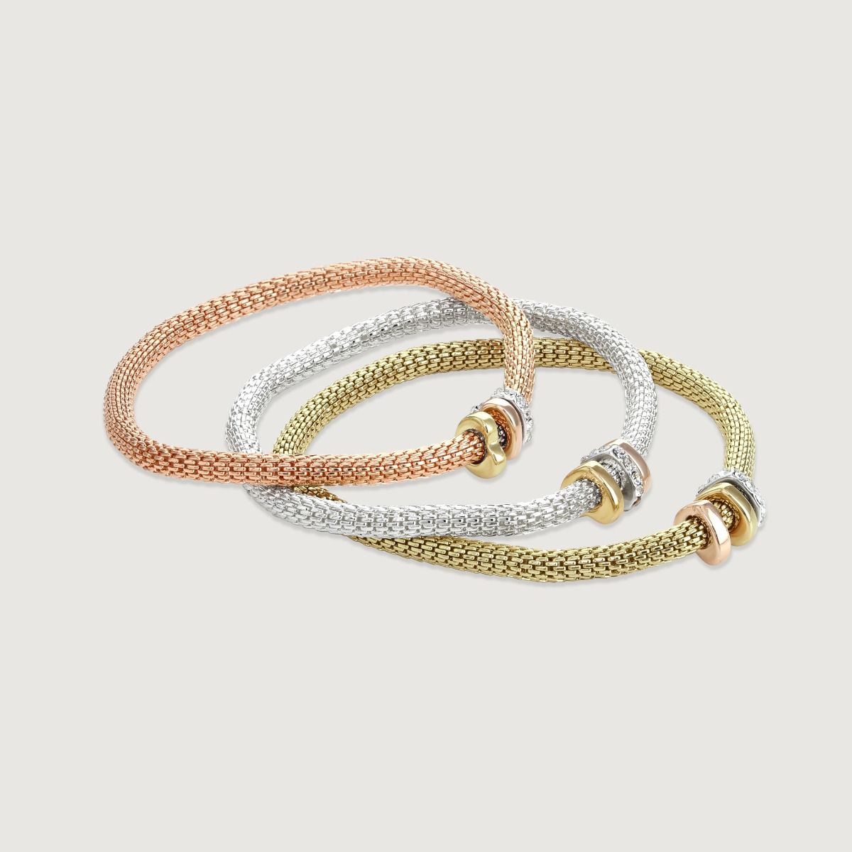 The ‘Set of 3 Mesh Bracelets’ are a cult classic. The mesh feature, allows the bracelet to comfortably sit on your wrist whilst showcasing the timeless mixed metal trio heart charms. 