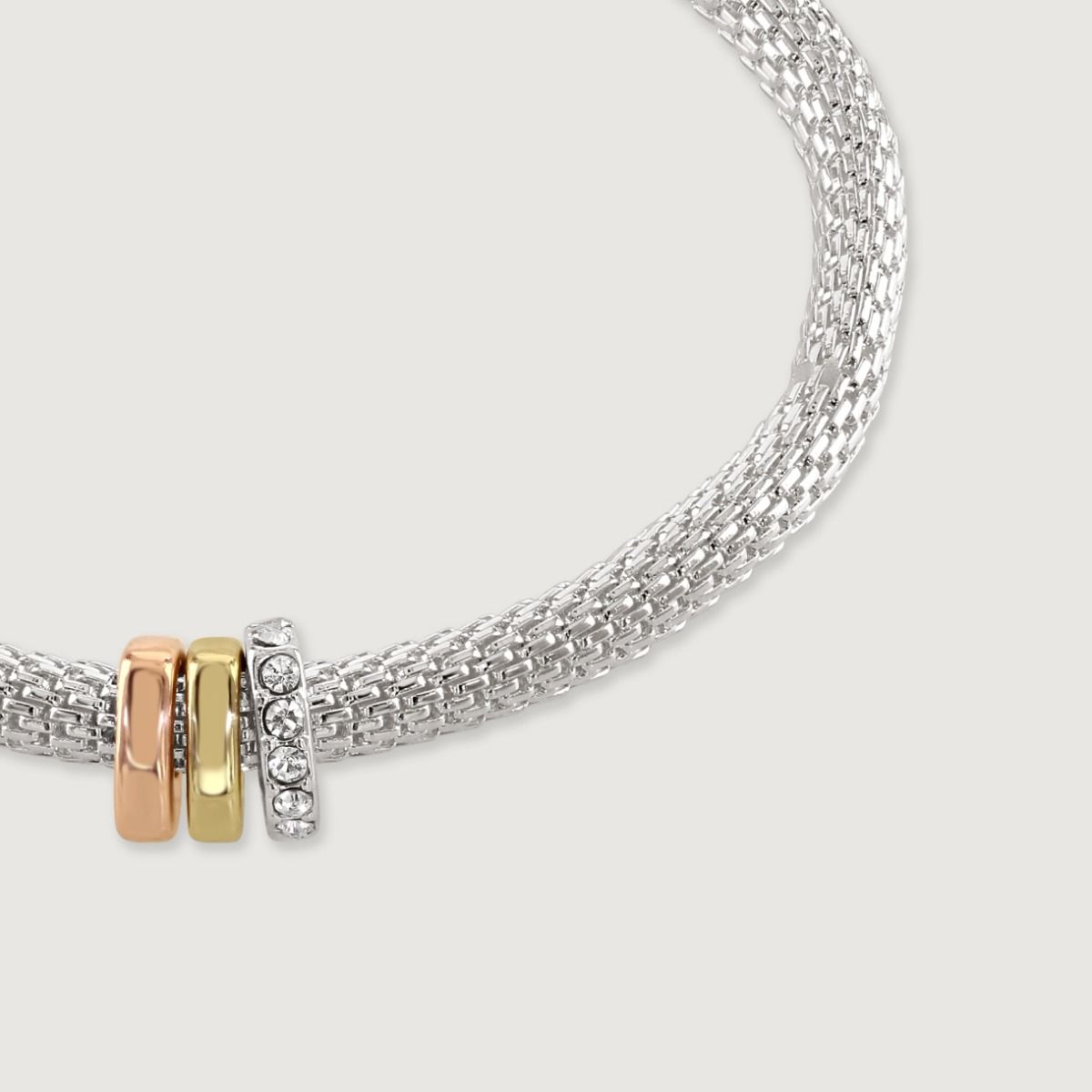 The Mesh Stretch Bracelet with Three Rondelles is a stylish and versatile piece. Featuring a mesh design that stretches for a comfortable fit, this bracelet is adorned with three rondelle hearts. The rondelles feature in gold, rose gold and silver, which 