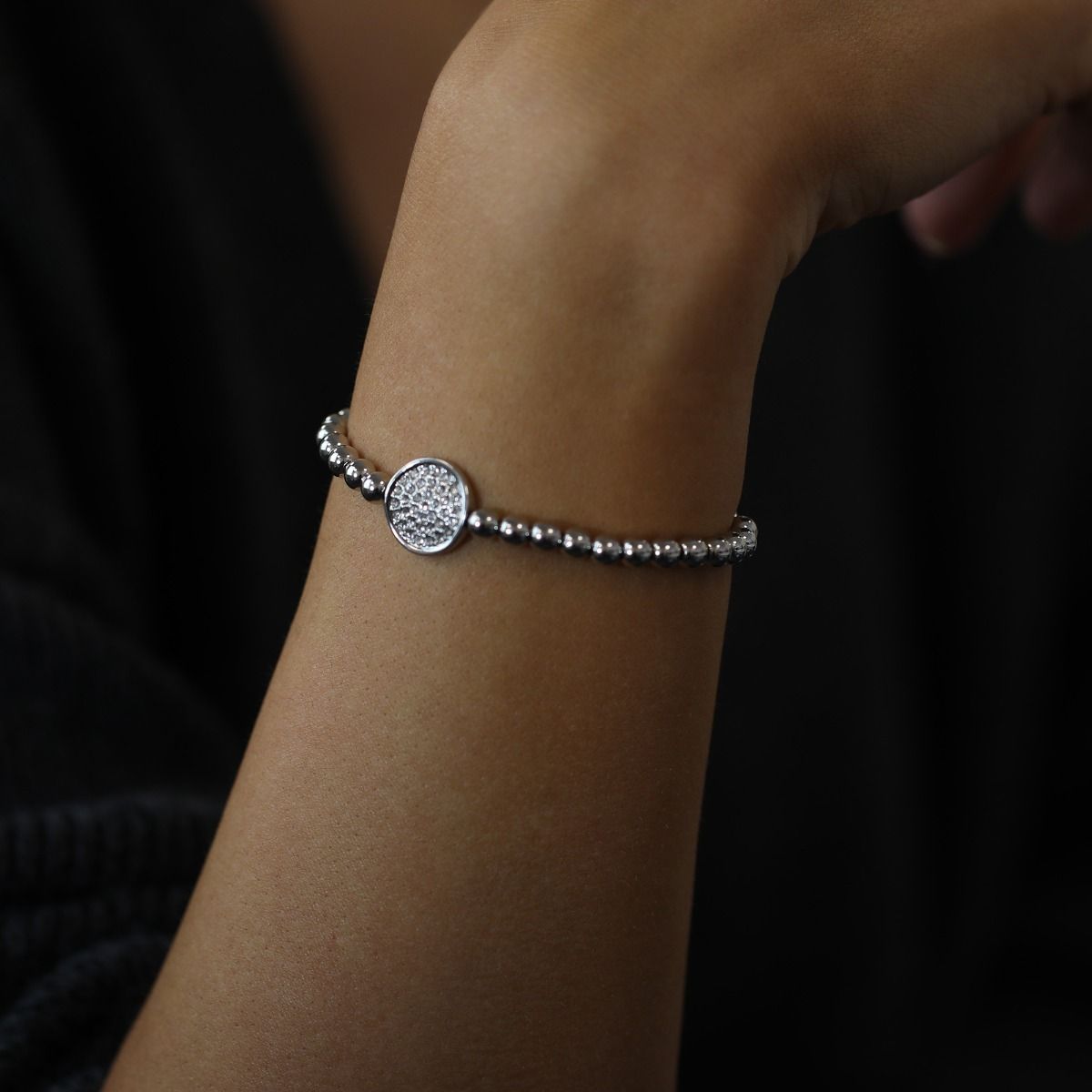This stylish beaded friendship bracelet features a sparkling pave disc, adding a touch of elegance to its vibrant design. Handcrafted with care, it embodies the spirit of unity and connection.