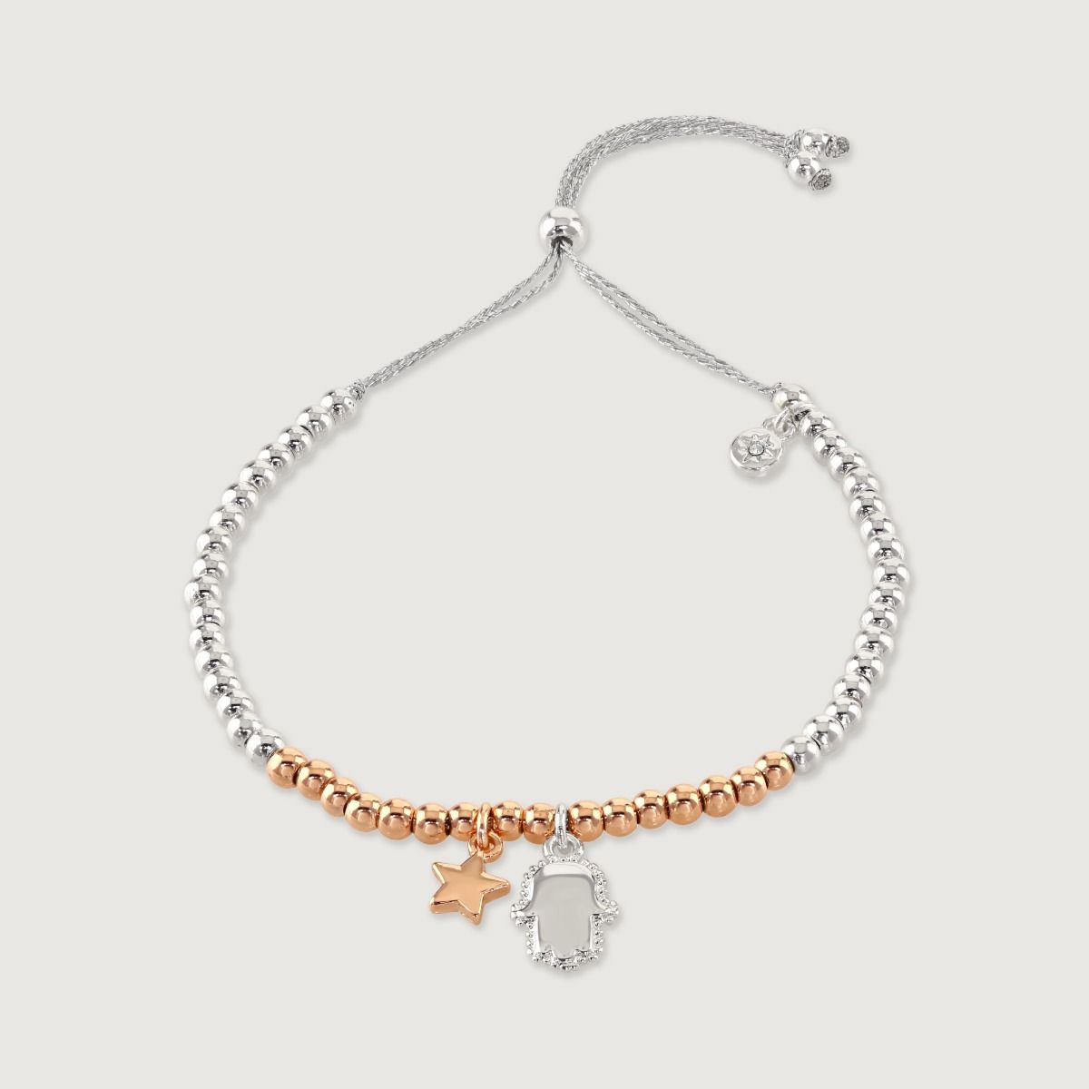 Embrace the essence of friendship with this beaded bracelet adorned with a hamsa hand and star charm. Handcrafted with care, it combines spirituality and celestial beauty. The hamsa hand symbolizes protection, while the star represents guidance. A meaning