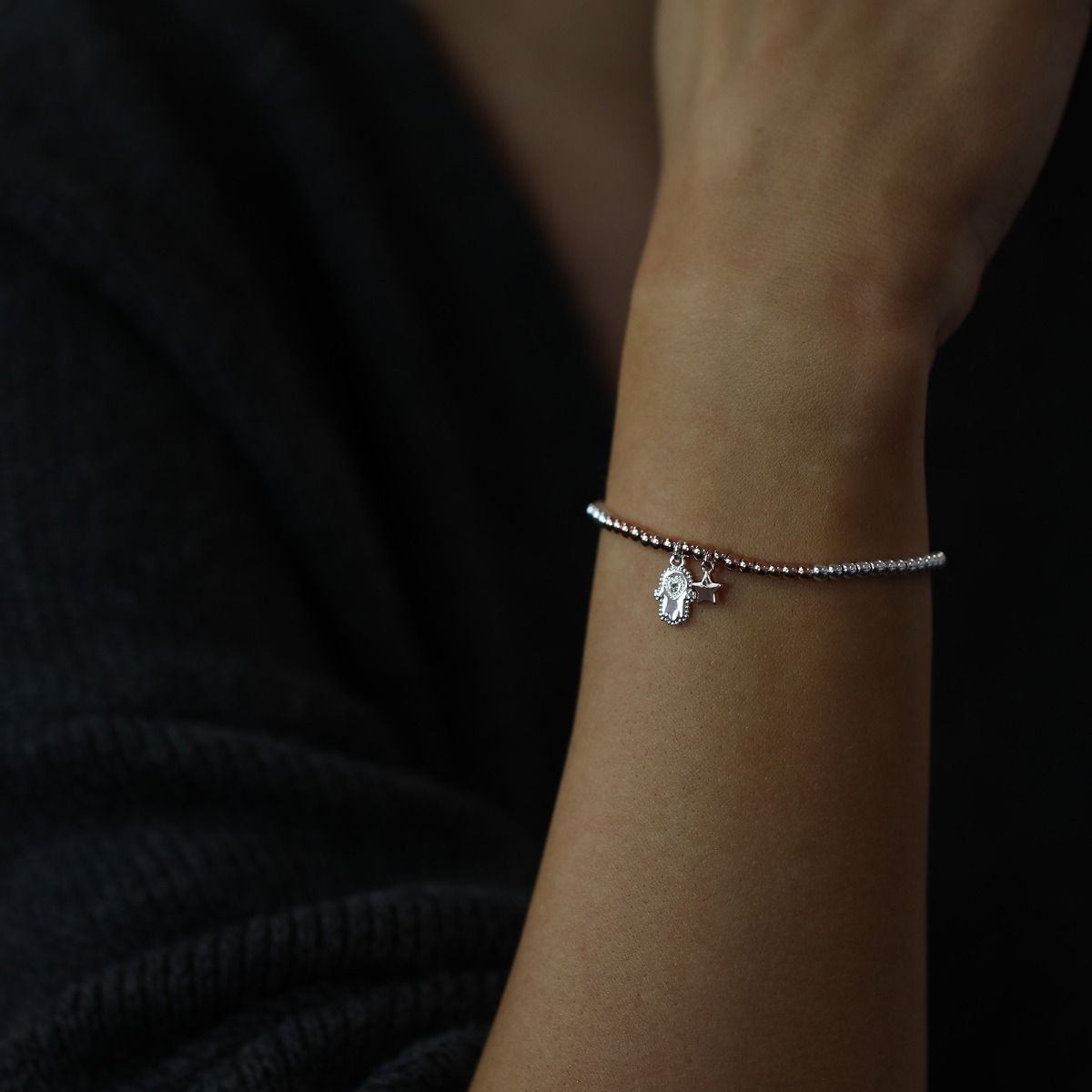 Embrace the essence of friendship with this beaded bracelet adorned with a hamsa hand and star charm. Handcrafted with care, it combines spirituality and celestial beauty. The hamsa hand symbolizes protection, while the star represents guidance. A meaning