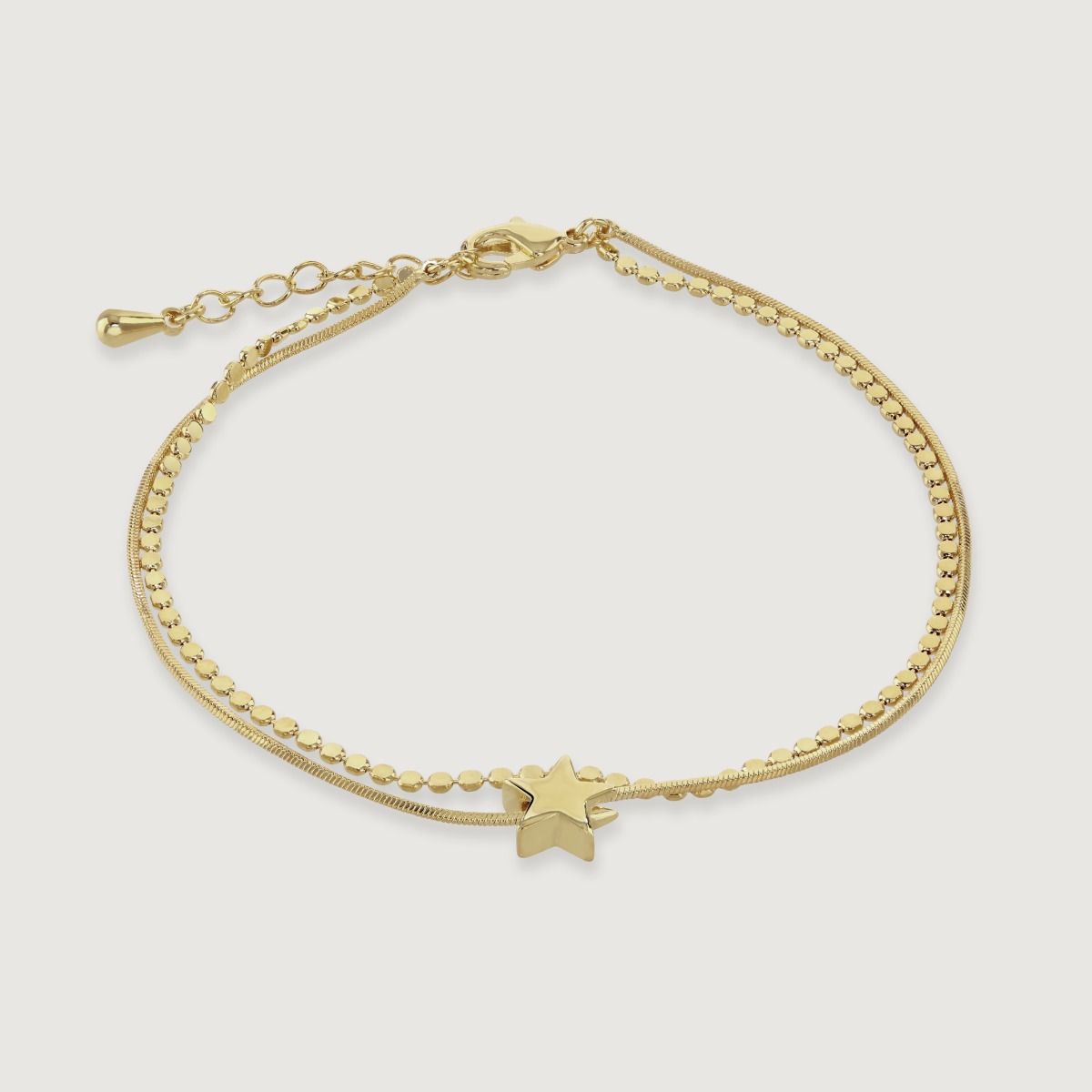 Elevate your style with this stunning double chain bracelet adorned with a star charm. Its delicate design adds a touch of celestial elegance to any outfit. Handcrafted with meticulous detail, it serves as a reminder to reach for the stars and embrace you