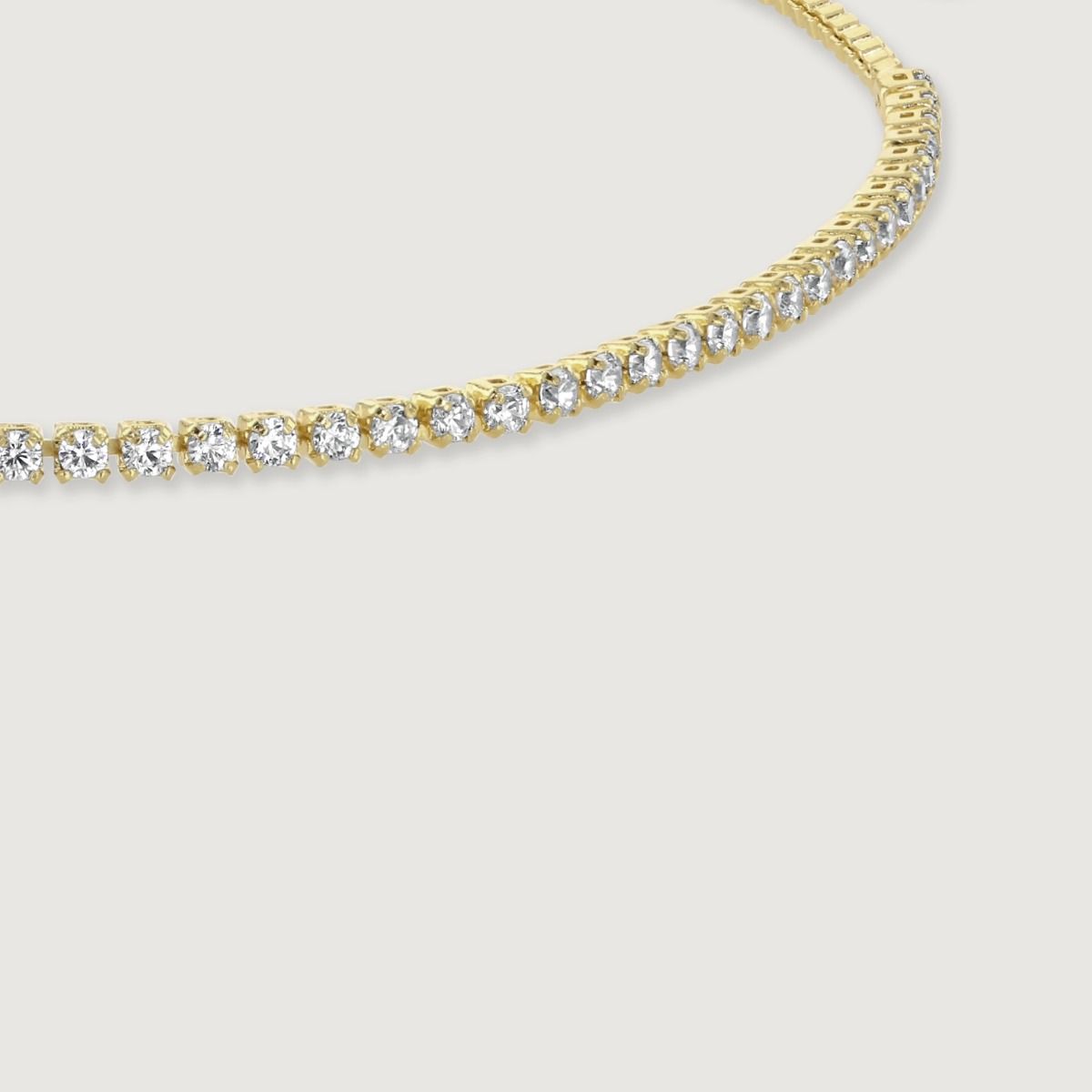 Experience the perfect blend of elegance and friendship with this gold crystal line and box chain bracelet. The shimmering crystals add a touch of glamour, while the box chain represents strength and unity. Handcrafted with love, it symbolises everlasting