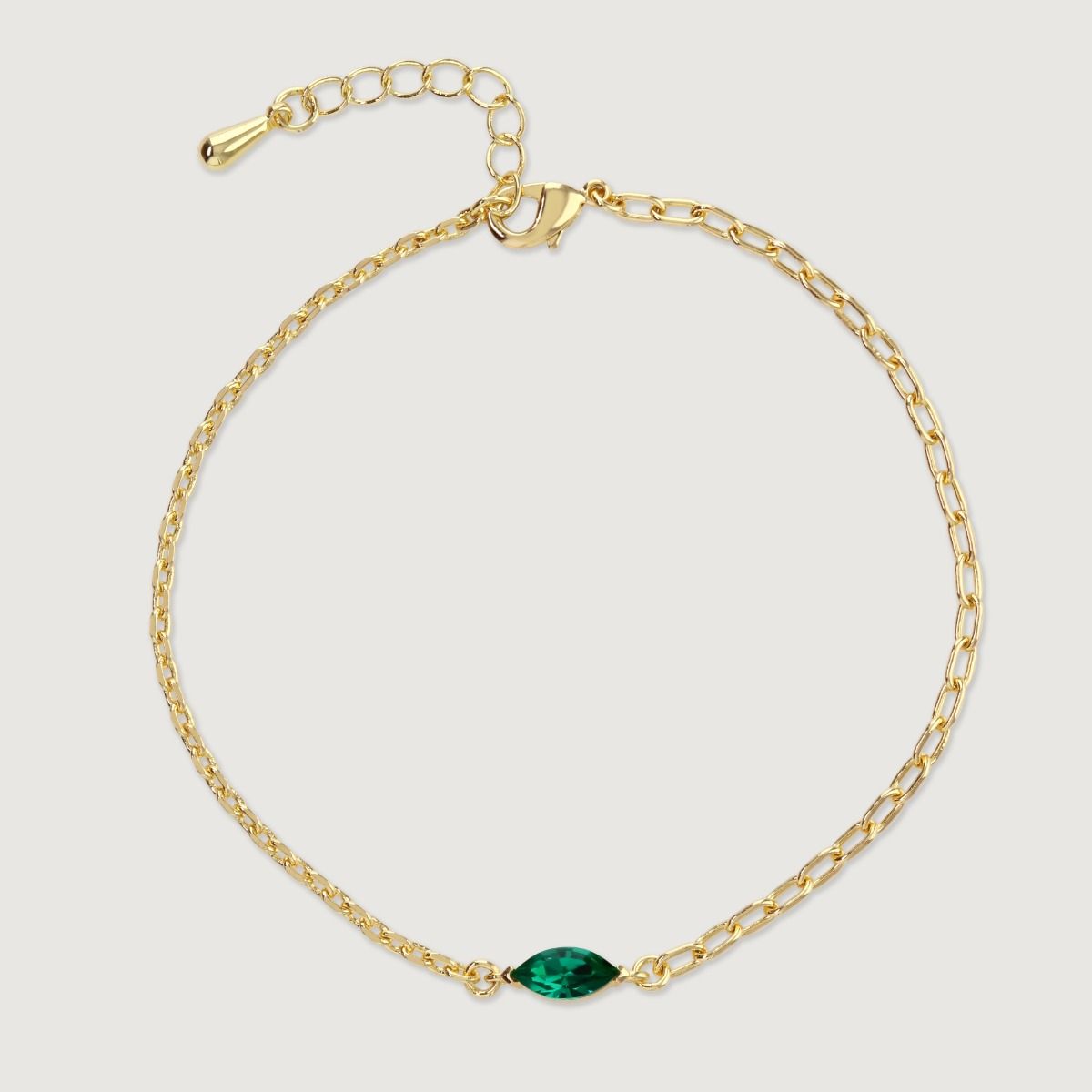 The Marquise Duo Chain Bracelet creatively blends fine and sturdy link chains, culminating in an eye-catching marquise stone at its centre. The vivid stone's pairing with the chains makes it a remarkable choice for layering with other chains or wearing as