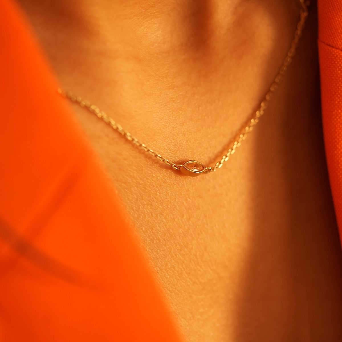 The Marquise Crystal Dainty Necklace showcases an elegant arrangement with three cubic zirconia marquise stones on both sides and at the centre of the chain. Its lightweight and adjustable chain guarantees a comfortable fit, while the strategically placed