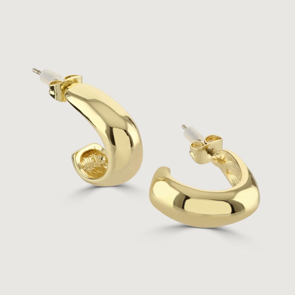 The Polished Gold Stud Hoop Earrings are a chic and versatile accessory. With their sleek and polished design, these earrings add a touch of glamour to any outfit. 