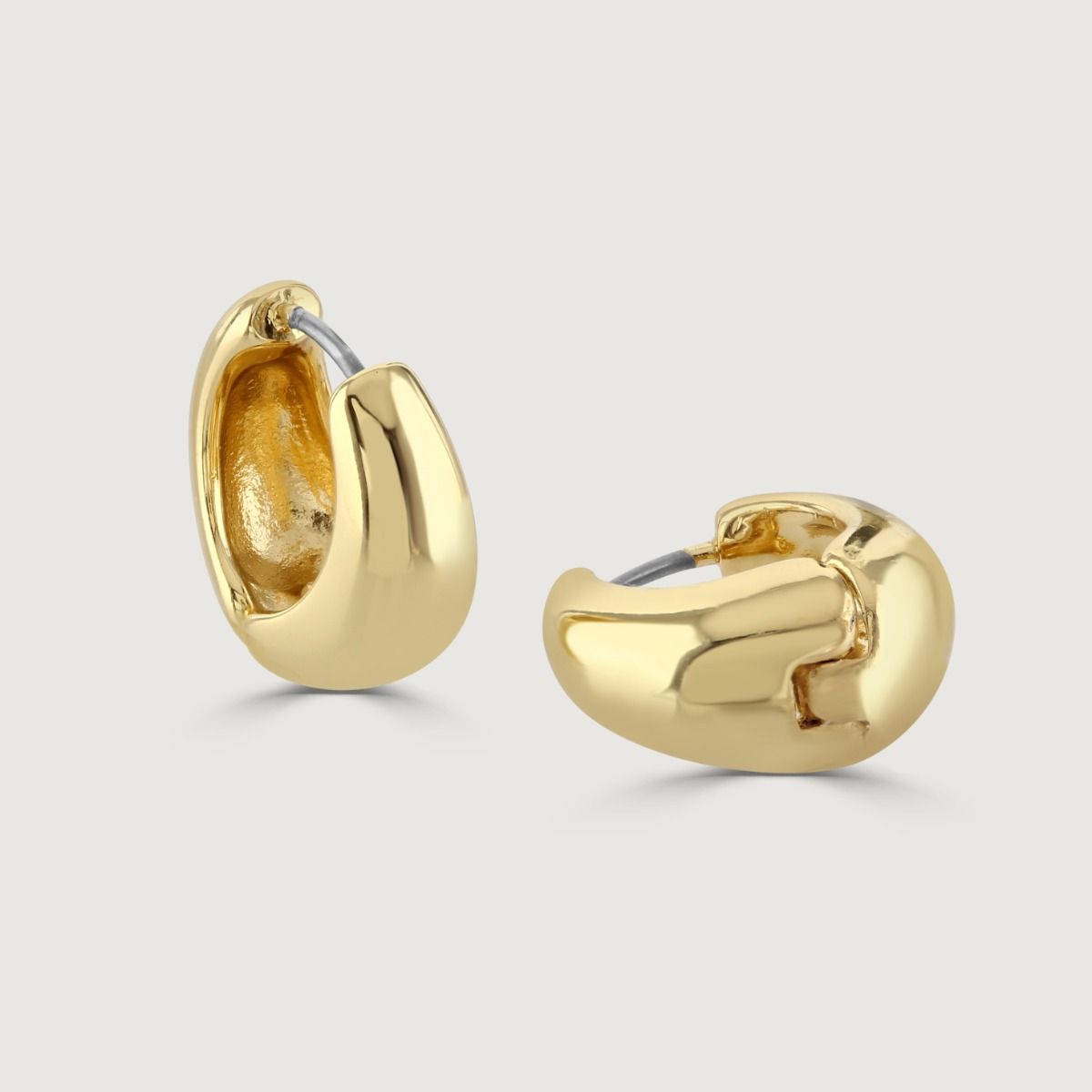 The Gold-Plated Huggie effectively combines elegance with a touch of modernity through the weighted centre. These huggies add a subtle element of sophistication, making them a perfect choice for adding a stylish edge to any ensemble.