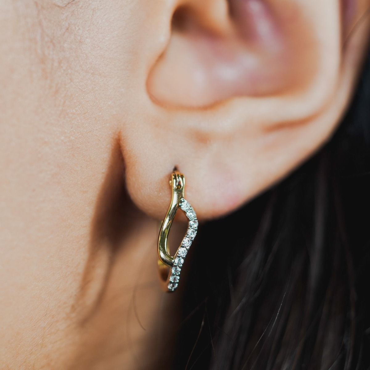 Elevate your style with the Two-Tone Pave and Polished Tide Earrings. Crafted with precision, this necklace showcases intertwining gold-polished and cubic zirconia pave bands, creating a captivating organic design. 