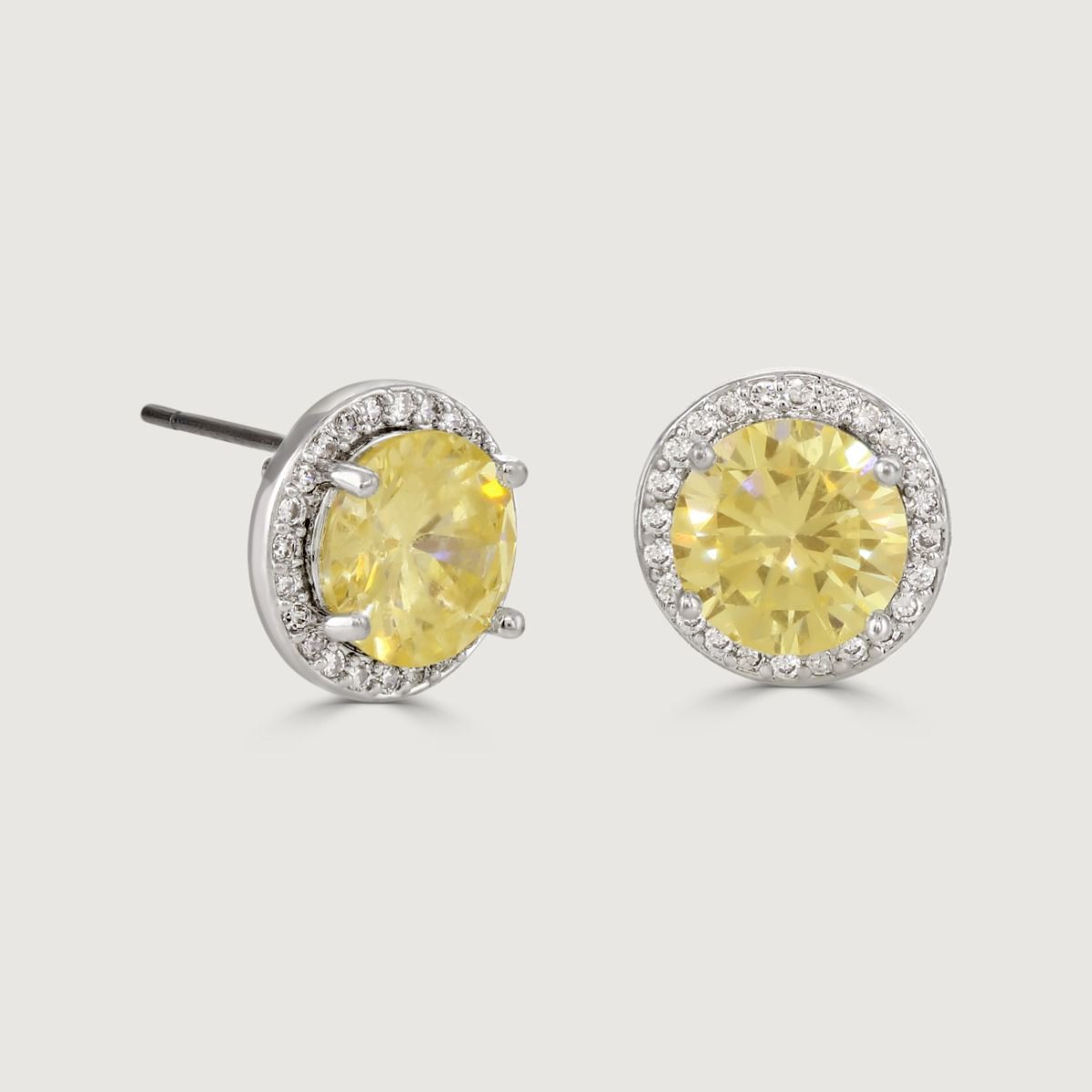These dazzling stud earrings are set with a halo of flawlessly cut cubic zirconia stones, surrounding a dazzling round canary centre stone. 