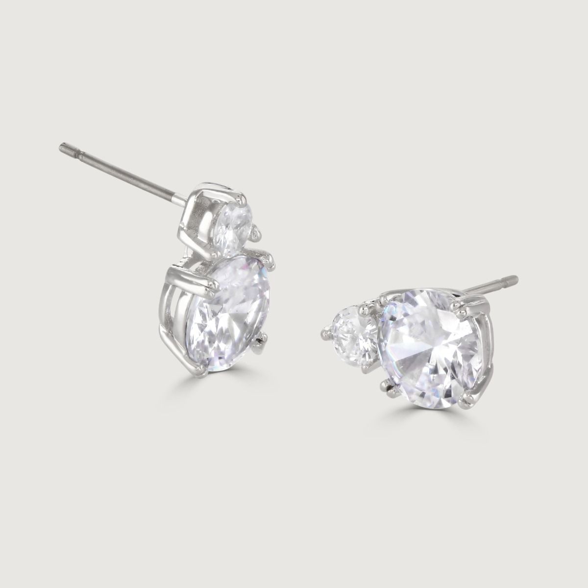 These show stopping stud earrings are set with a flawless brilliant cut cubic zirconia above a striking cushion cut clear stone. Wear to add timeless glamour to any look.