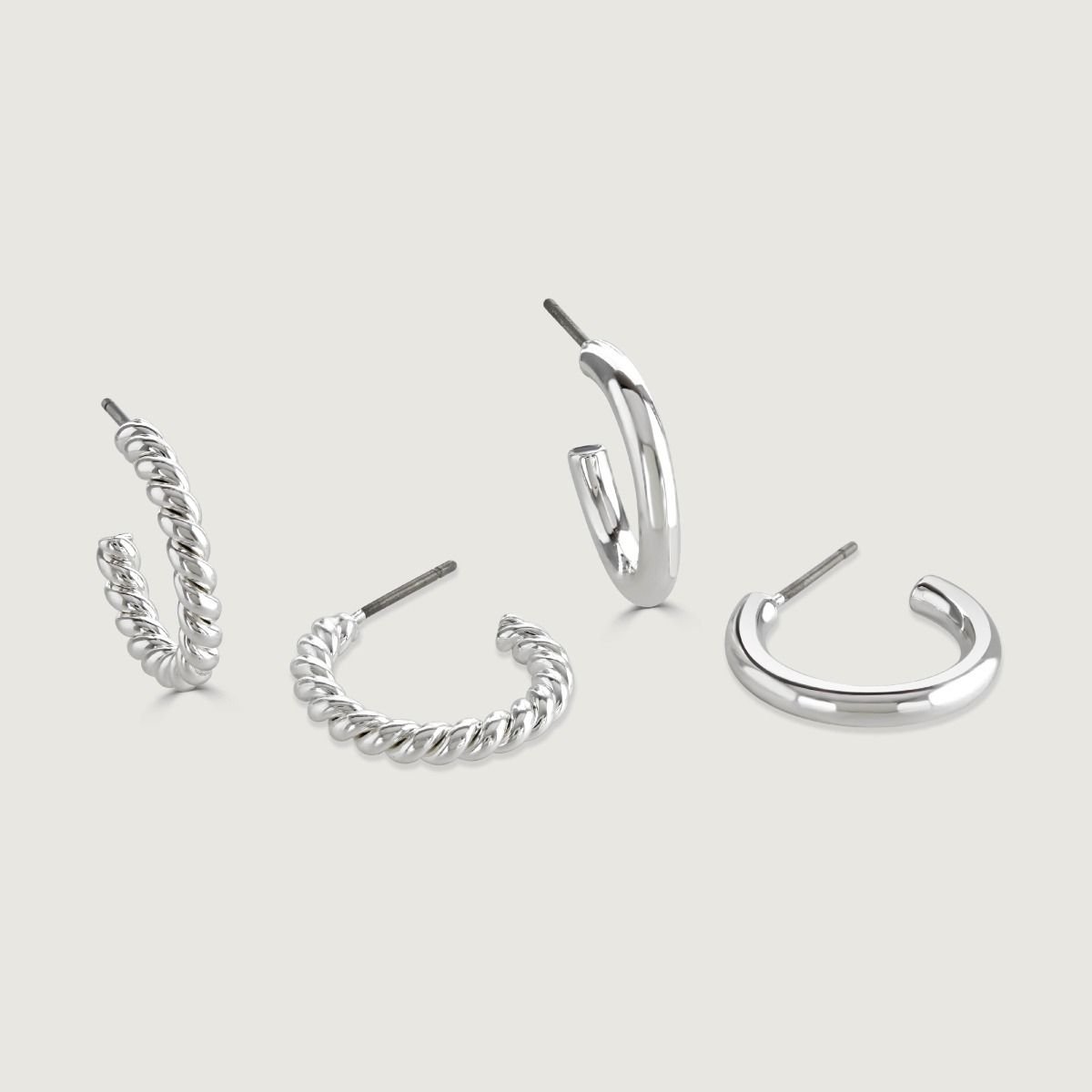 Freya Silver Hoop Duo  The Freya Earring Duo features two pairs of contrasting hoops in silver plate; one sleek, smooth and polished and the other a twisted, braid design.  