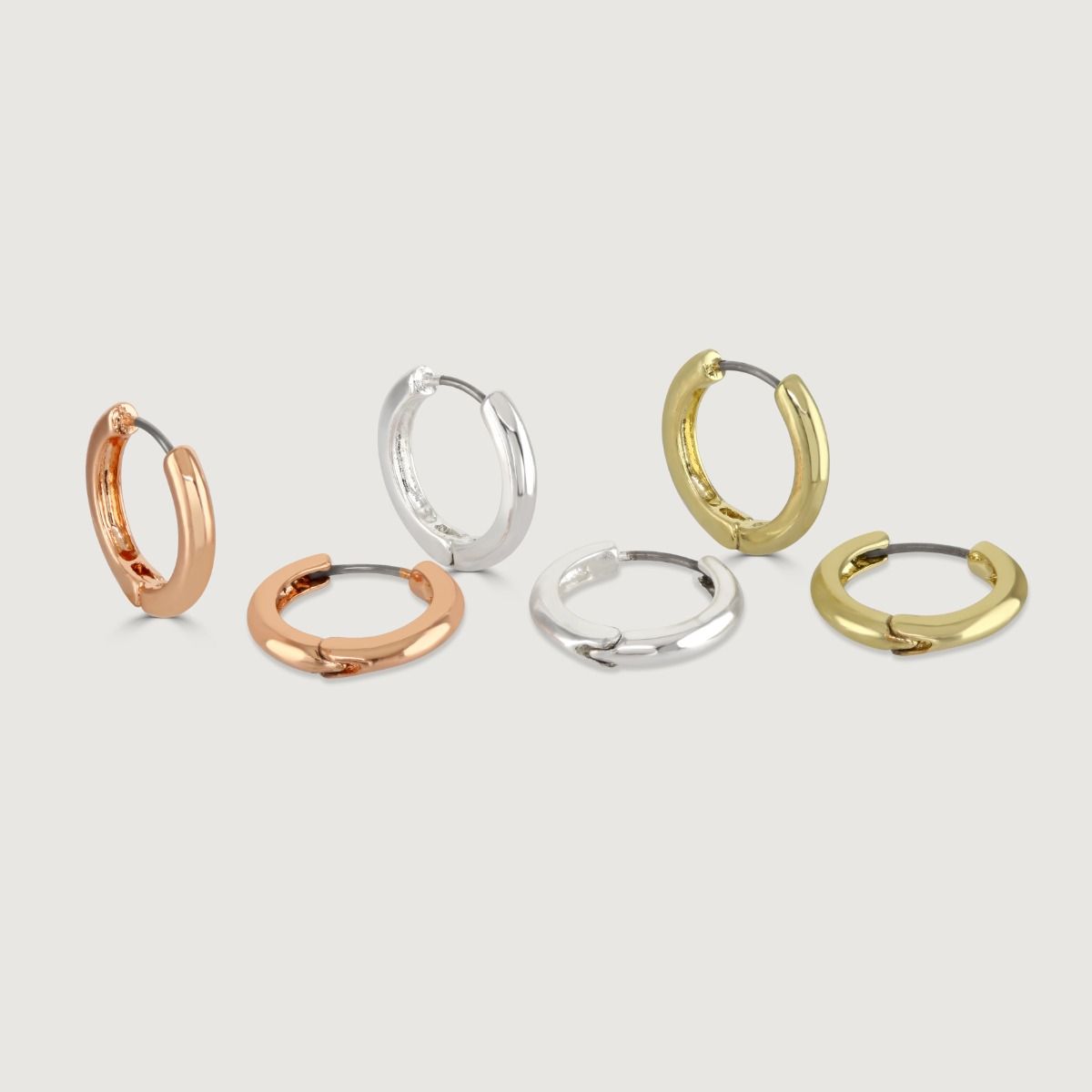 The Set of 3 Hoop Earrings offers versatility and style in one package. With three different metallic tones to choose from, these hoop earrings allow you to mix and match or wear them individually. Effortlessly elevate your look with this set, perfect for