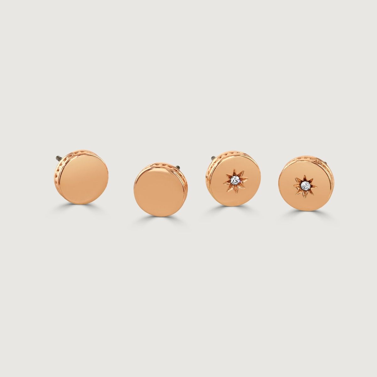 The Polished Set of Two Rose Gold Stud Earrings is a versatile and stylish accessory. Crafted with precision and care, these earrings feature a polished rose gold finish that exudes sophistication. With two different designs in the set, they offer versati