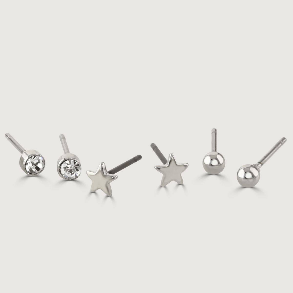 Elevate your earring game with this exquisite Set of Four Imitation Rhodium Earrings. Featuring a variety of styles, including plain studs, playful pineapple designs, sparkling crystal studs, and trendy hoop earrings, this collection offers versatility an