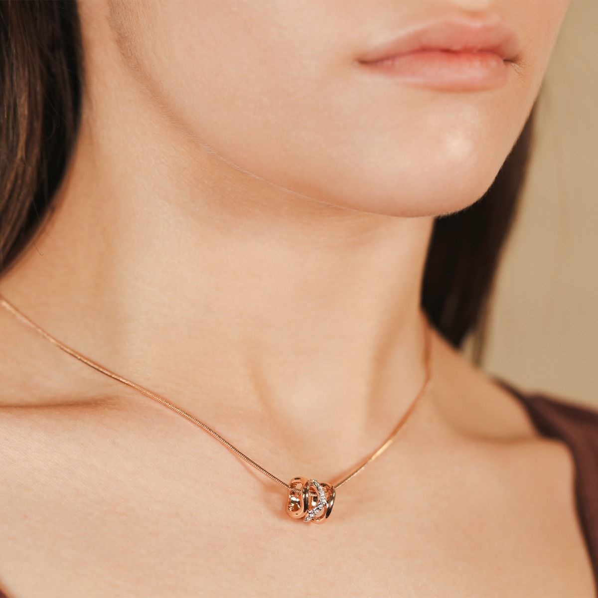Depicting flowing energy and movement, the Bayswater pendant is modern and luxurious. Soft swirls of rose gold and rhodium-plated bands come together with subtle white crystal details and a delicate snake chain to create a stunning and intricate design.