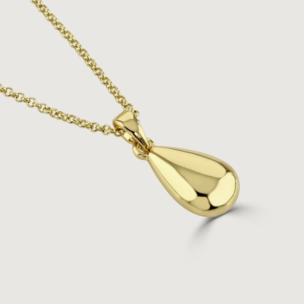 The Tear Drop Gold Polished Pendant is a stunning and versatile accessory. With its sleek and polished gold finish, this pendant showcases a timeless elegance. The tear-drop shape adds a touch of grace and sophistication. 