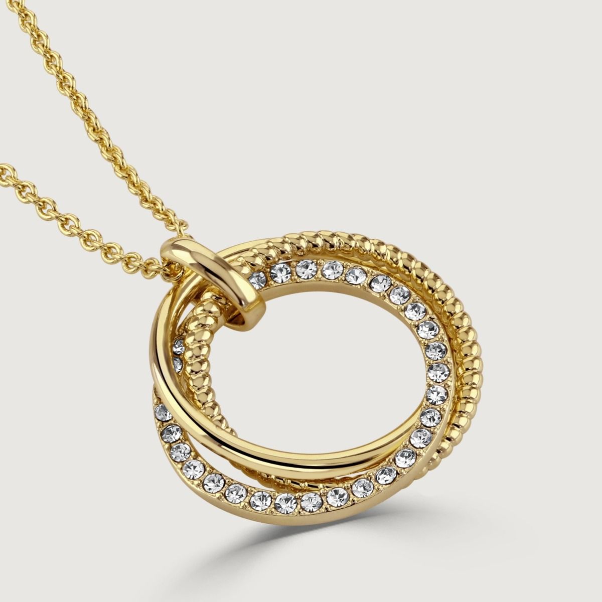 The polished trio hoop pendant presents a contemporary flair with its plain, textured and crystal hoops. Not only does this pendant experiment with texture, but it adds visual appeal. 