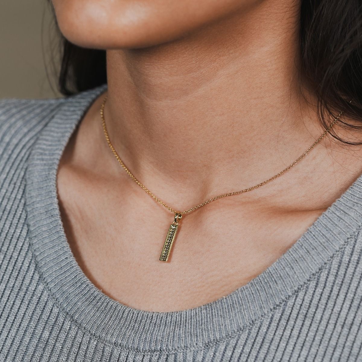 Elevate your elegance with the Pave Bar Necklace. Adorned with cubic zirconia, this necklace adds a touch of luxury to any ensemble. Its exquisite design and meticulous craftsmanship make it a must-have accessory for those who appreciate refined beauty.