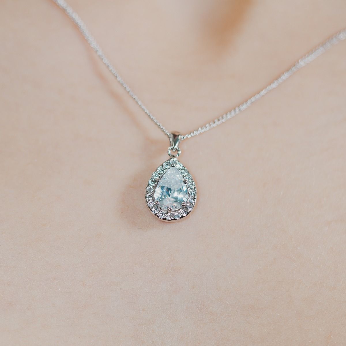 Elevate your elegance with our Clear Sparkle Pear Pendant. Meticulously crafted cubic zirconia stones frame a captivating canary pear cut centre, radiating sophistication. 