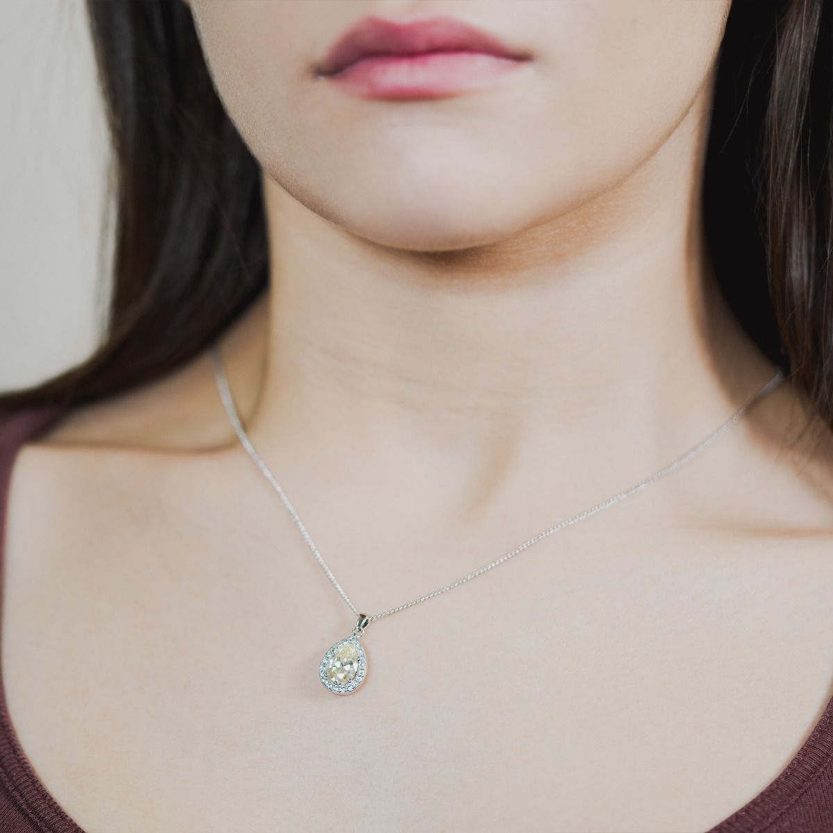 Elevate your elegance with our Canary Sparkle Pear Pendant. Meticulously crafted cubic zirconia stones frame a captivating canary pear cut centre, radiating sophistication. 