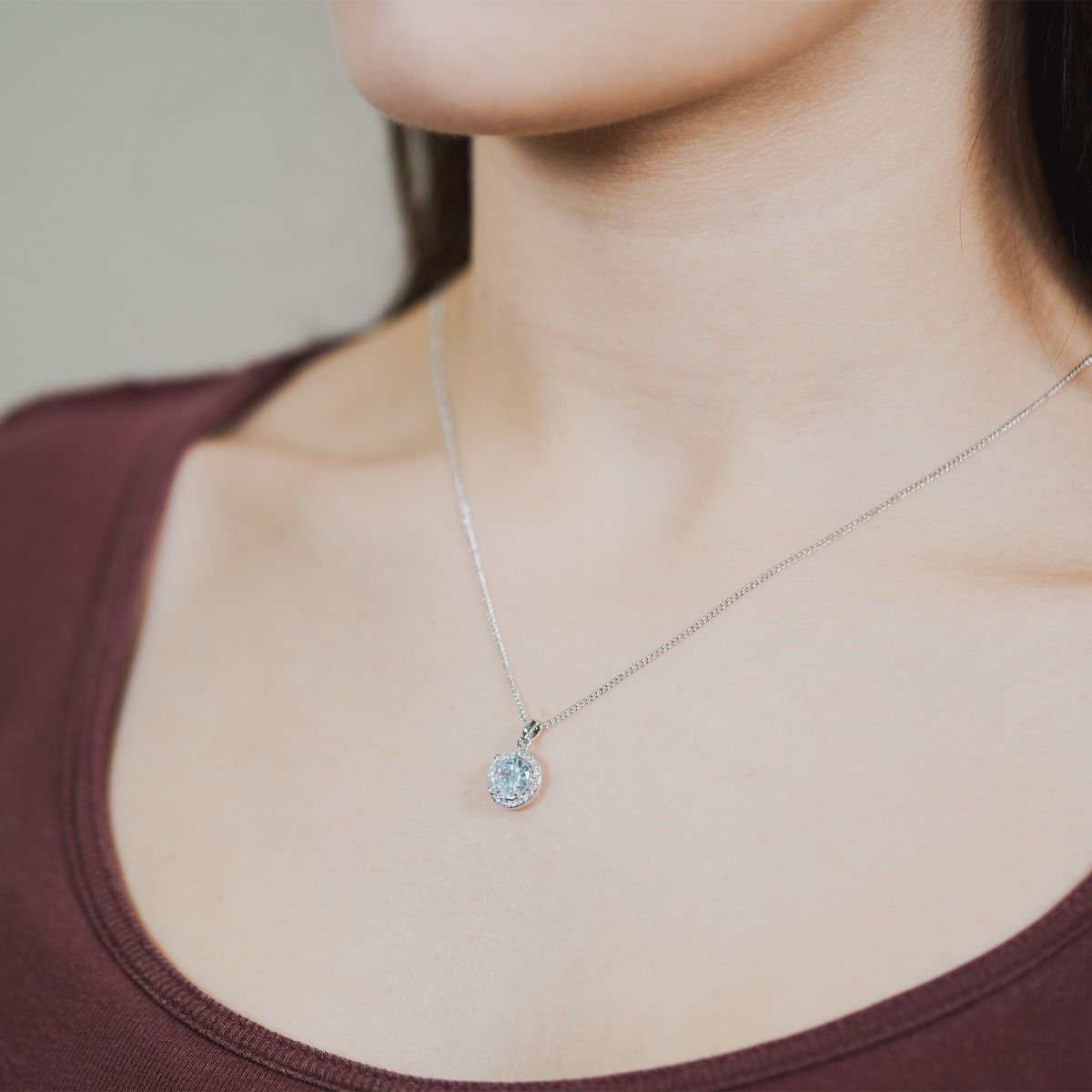 Unveil the charm of our Clear Cushion Halo Pendant, showcasing meticulously crafted cubic zirconia stones encircling a radiant clear cushion-cut centre. Elevate your style with this timeless piece, infusing each outfit with an enduring touch of glamour.