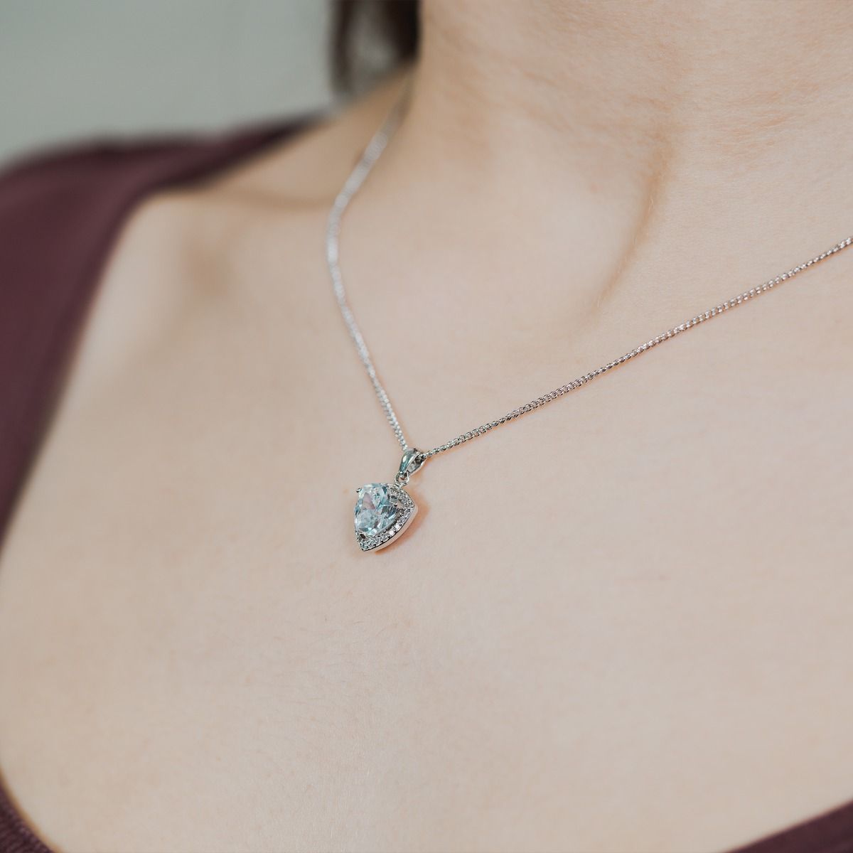 Experience enchantment through our Clear Trillion Halo Pendant. The impressive trillion-cut centre stone emanates a captivating allure. Effortlessly elevate your style with this exquisite piece, infusing timeless glamour into any ensemble.