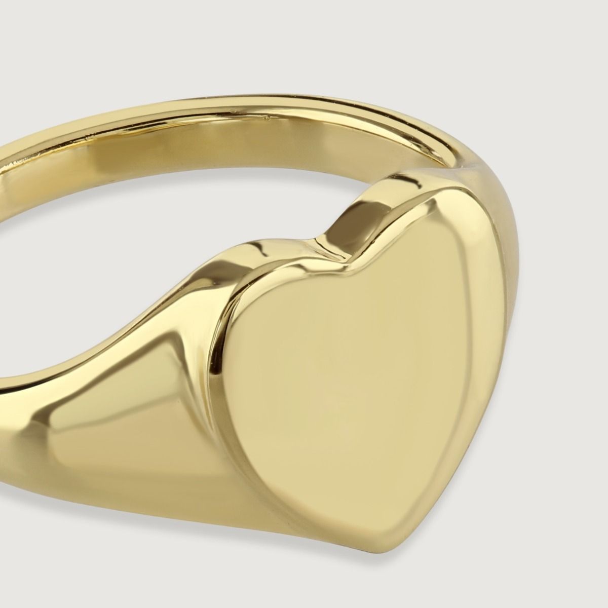 The Heart Design Gold Signet Ring is a stunning piece of jewellery that combines timeless elegance with a touch of romance. Crafted with meticulous attention to detail, this ring features a heart-shaped design on the signet, creating a symbol of love and 