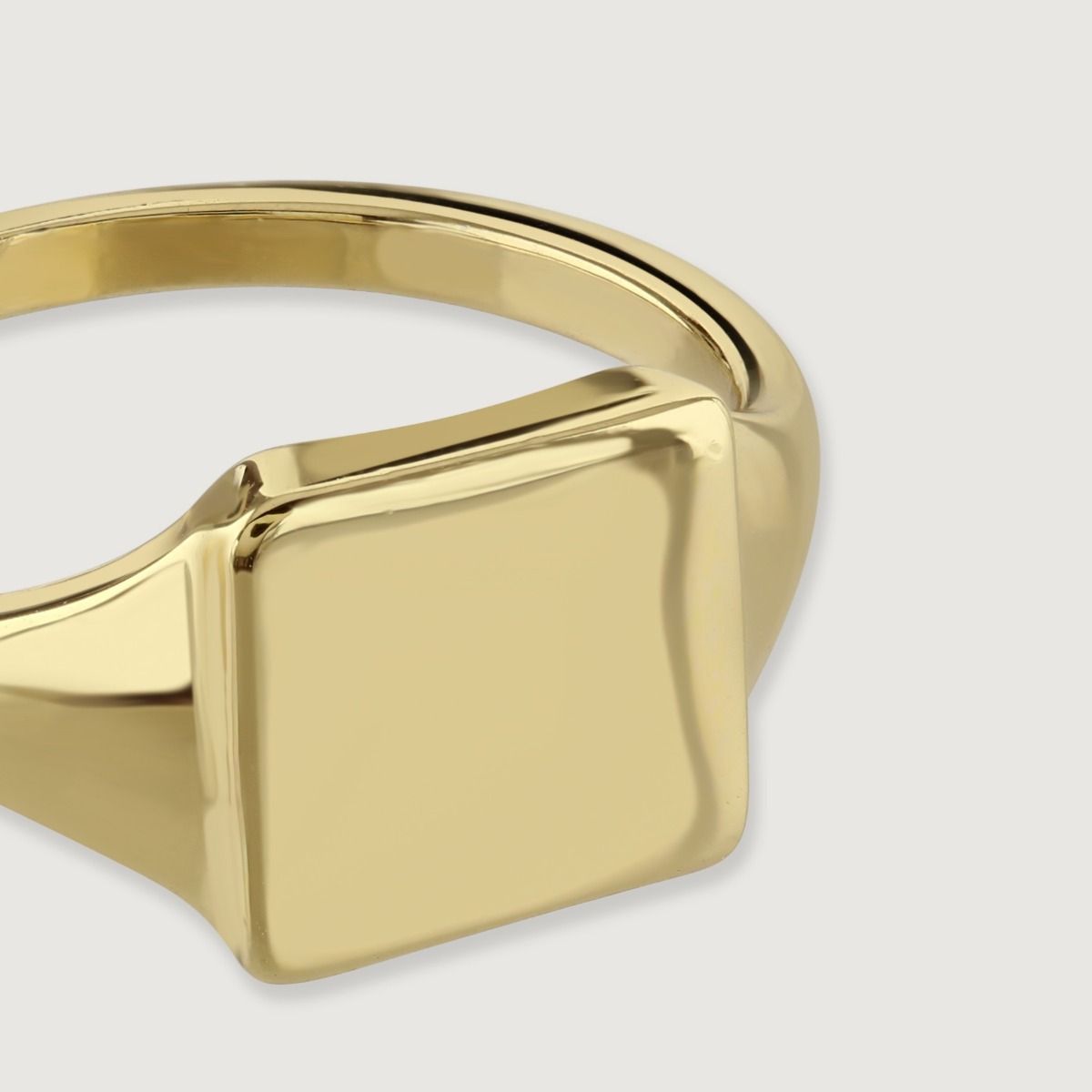 The Square Design Gold Signet Ring is a bold and sophisticated piece of jewellery. Crafted with exquisite detail, this ring showcases a sleek and modern square design on the signet. Made with luxurious gold, it exudes a sense of elegance and style, making