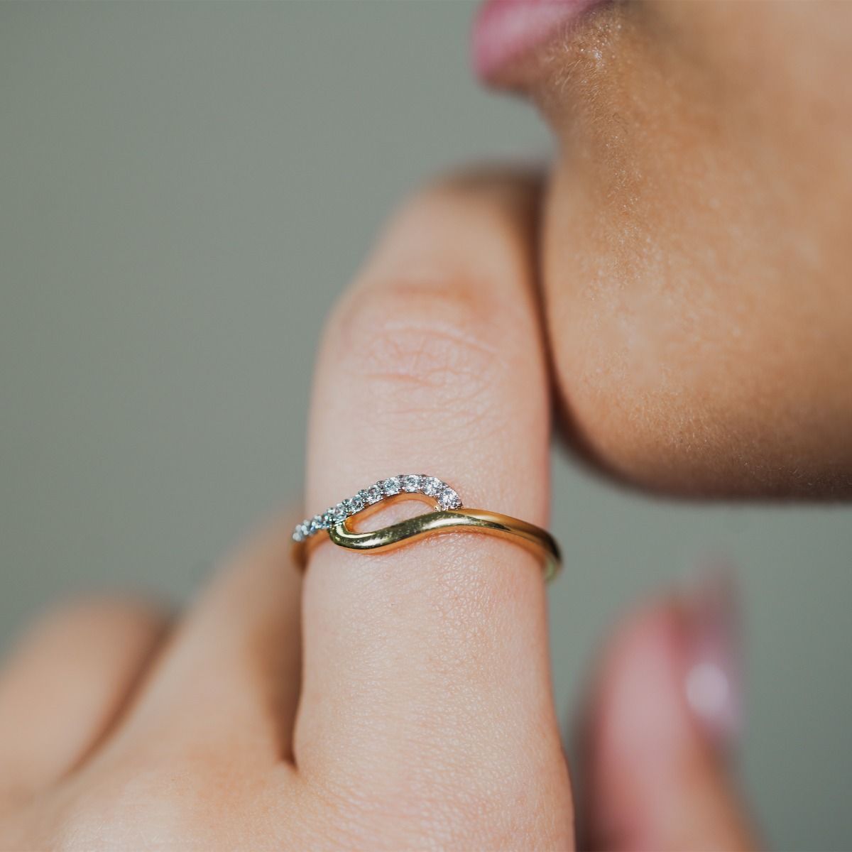 Elevate your style with the Two-Tone Pave and Polished Tide Ring. Crafted with precision, this necklace showcases intertwining gold-polished and cubic zirconia pave bands, creating a captivating organic design. 