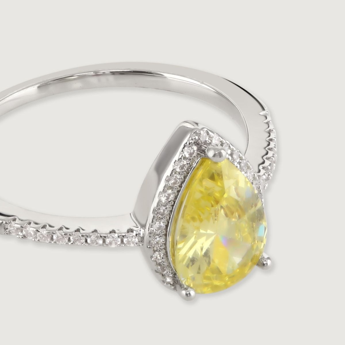This beautiful ring features a dazzling pear cut canary centre stone set with a surround of flawlessly cut cubic zirconia stones. Wear to add timeless glamour to any look. 