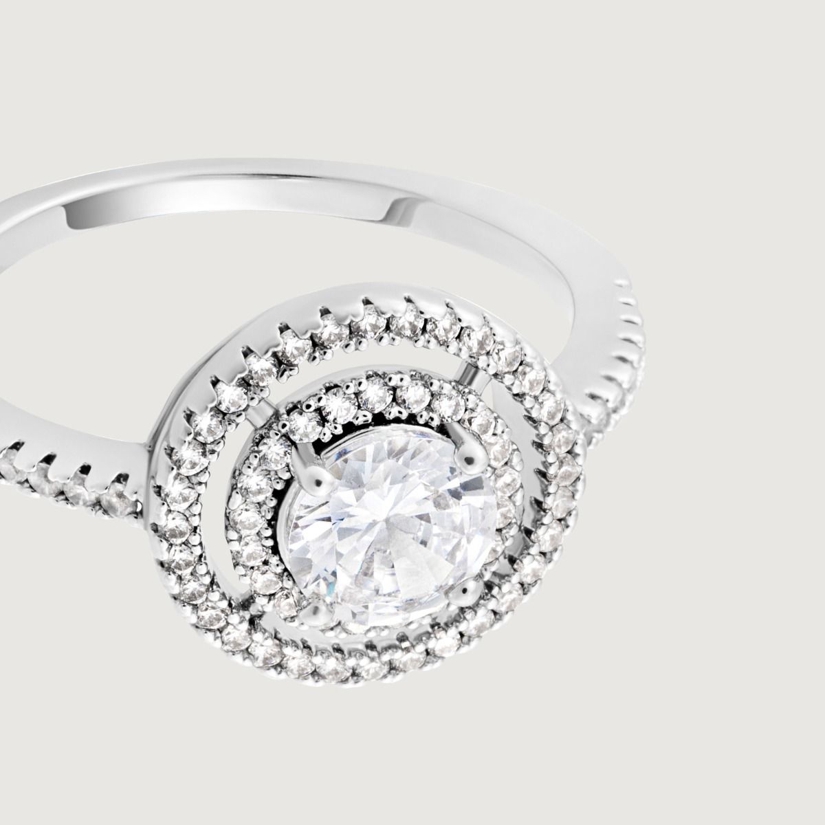 Make a statement with this stunning brilliant cut double halo ring. The centre brilliant cut cubic zirconia is delicately surrounded with smaller sparkling cubic zirconia stones creating a dramatic, cut out effect.