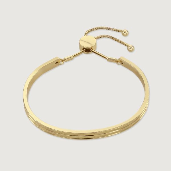Inspired by the bustle and fun of the city, this striking bangle allows you to add style to any outfit. Featuring a modern take on a classic friendship bracelet design, with a faceted finish to accentuate the shine. 