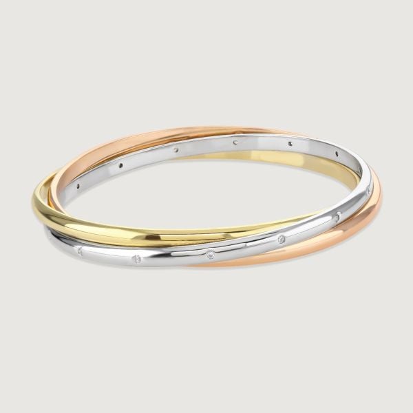 The Russian Trio bangle is Buckley London's top-selling piece and has won several awards as a beautiful and timeless gift. Each individual ring is plated with either gold, rose gold, or rhodium to create the three colours. 
