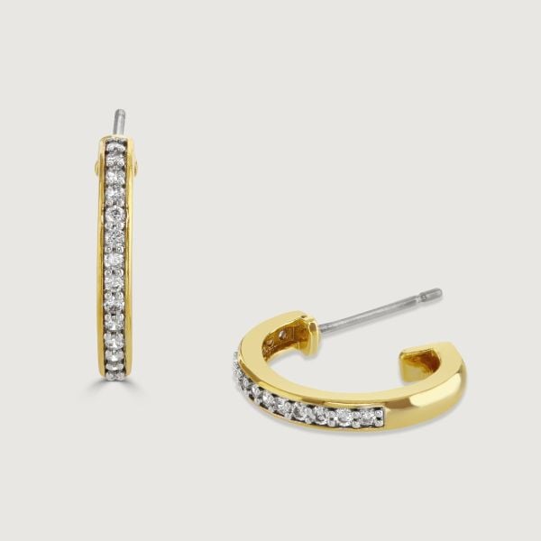 Elevate your style with our Two-Tone Pave Hoop Earrings. A sleek plain band elegantly contrasts with a sparkling centre of cubic zirconia stones. 