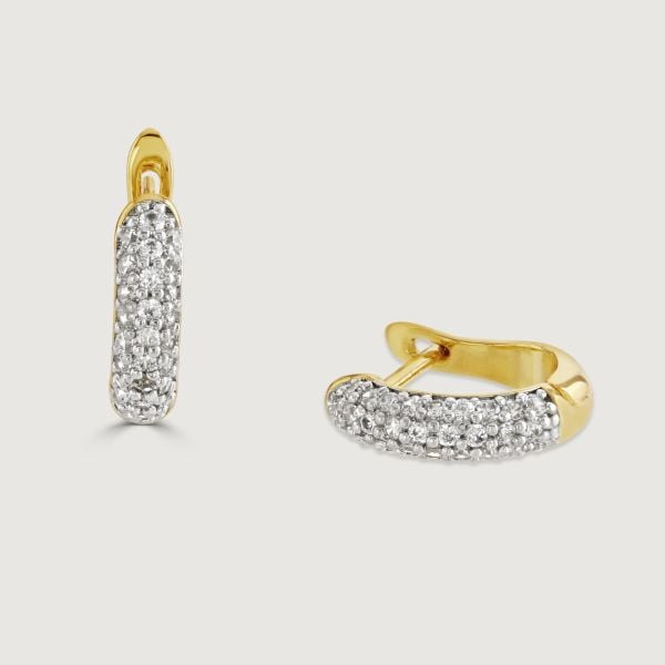 Elevate your style with the Cluster Hoop Earrings. These exquisite earrings boast a latch back adorned with a cubic zirconia cluster hoop. The design seamlessly transitions into a sleek polished band, offering a perfect blend of sophistication and charm. 