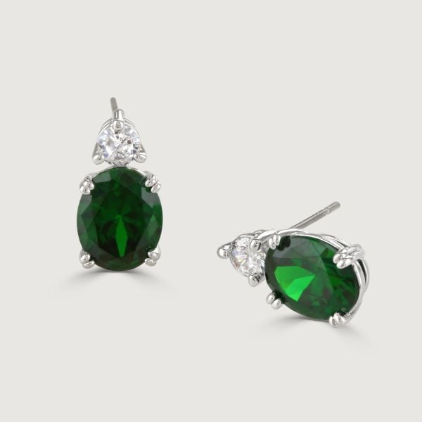 Unveil enchantment with our Emerald Oval Double Drop Earrings. A stunning halo of flawlessly cut glass stones encircles an impressive cushion-cut centre stone, radiating a captivating allure. 