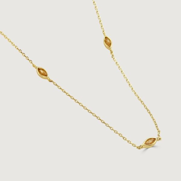 The Marquise Crystal Dainty Necklace showcases an elegant arrangement with three cubic zirconia marquise stones on both sides and at the centre of the chain. Its lightweight and adjustable chain guarantees a comfortable fit, while the strategically placed
