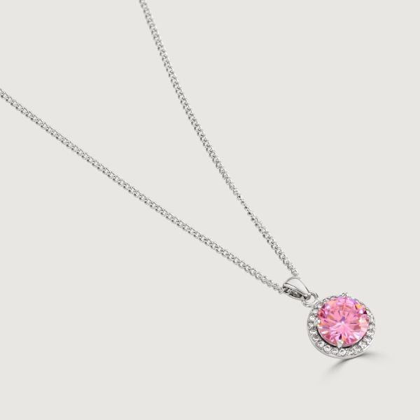 Experience enchantment through our Pink Halo Pendant. The impressive round-cut centre stone emanates a captivating allure. Effortlessly elevate your style with this exquisite piece, infusing timeless glamour into any ensemble.