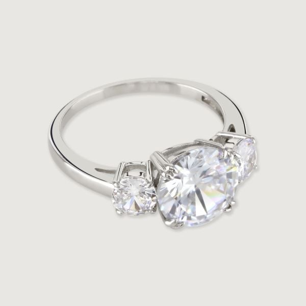 A truly stunning trinity ring featuring a trio of brilliant cut cubic zirconia stones flawlessly faceted to reflect the light for diamond inspired look. This beautiful ring brings eye catching elegance to every occasion.