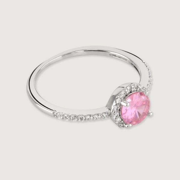 Make a statement with this stunning brilliant cut dazzling pink ring. Delicately surrounded with a halo of sparkling cubic zirconia stones surrounding the centre stone and down the band, creating a dramatic, elegant look.