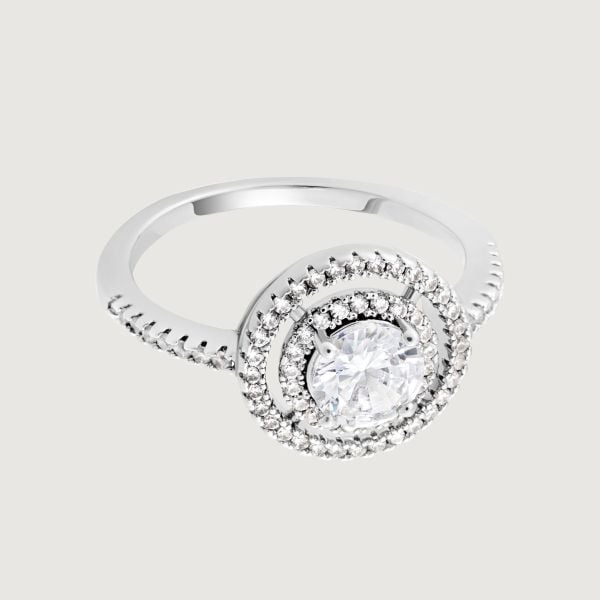 Make a statement with this stunning brilliant cut double halo ring. The centre brilliant cut cubic zirconia is delicately surrounded with smaller sparkling cubic zirconia stones creating a dramatic, cut out effect.
