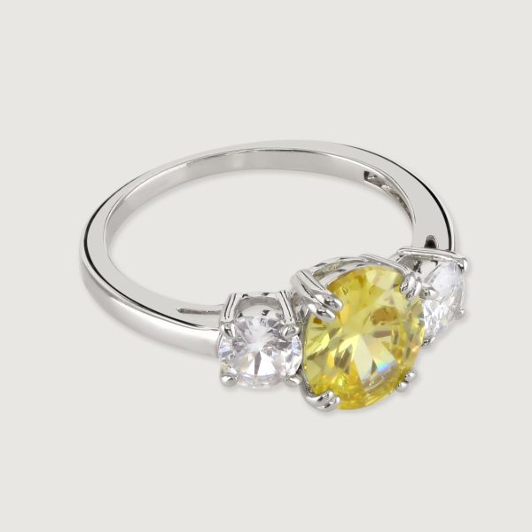 A truly dazzling design, this stunning ring features a canary coloured oval centre stone between two smaller  brilliant cut clear cubic zirconia stones. 